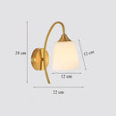 Classic brass glass wall sconce with frosted shade for bedroom
