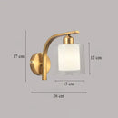 Classic brass glass wall sconce with frosted shade for bedroom