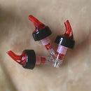 Clear and red plastic liquor pourer bottle dispenser kitchen barware