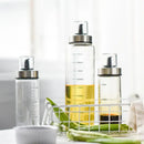 Clear glass condiment bottle set with measurements for kitchen