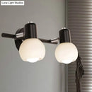 Contemporary black & chrome milk glass globe sconce – living room light