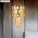 Contemporary black & gold sconce with teardrop crystals living room