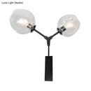 Contemporary black & gold wall sconce bedroom clear glass shade