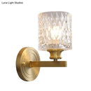 Contemporary brass cylindrical wall light bedroom faceted glass sconce