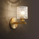 Contemporary brass cylindrical wall light bedroom faceted glass sconce