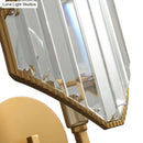 Contemporary brass rhombus wall sconce with clear crystal prism bedroom