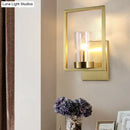 Contemporary brass wall light clear glass cylinder bedroom light fixture