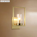 Contemporary brass wall light clear glass cylinder bedroom light fixture