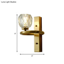 Contemporary brass wall sconce with global crystal shade dining room