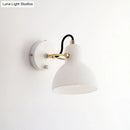 Contemporary brass & white glass wall lamp for bedroom with adjustable arm