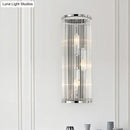 Contemporary chrome wall sconce with clear crystal tube for bedroom