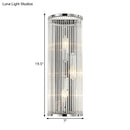 Contemporary chrome wall sconce with clear crystal tube for bedroom