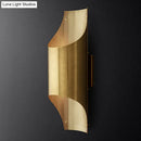 Contemporary curved brass wall lamp for living room