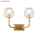 Contemporary gold dome foyer wall light with clear lattice glass