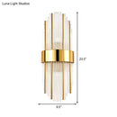 Contemporary gold wall light with clear crystal shade – living room