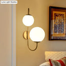 Contemporary gold wall sconce bedroom light with opal glass shade
