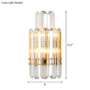 Contemporary gold wall sconce with clear crystal prisms for dining room