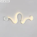 Contemporary twist black & white wall sconce – bedroom warm white light