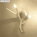 Contemporary white resin antler wall sconce for restaurant dining room