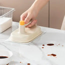 Cream and yellow silicone kitchen cleaning brush with replaceable head
