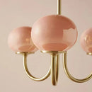 Cream pink bedroom pendant light with three glass globes and brass