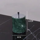 Dark green marble bathroom accessory set with gold accents