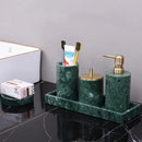 Dark green marble bathroom accessory set with gold accents