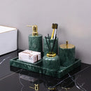 Dark green marble bathroom accessory set with gold accents