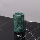 Dark green marble bathroom accessory set with gold accents