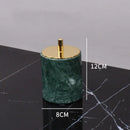 Dark green marble bathroom accessory set with gold accents