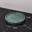 Dark green marble bathroom accessory set with gold accents
