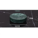 Dark green marble bathroom accessory set with gold accents