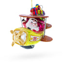 Santa Delivering Gifts on Airplane Glass Christmas Ornament