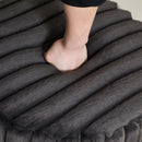 22.05' Wide Upholstered Round Pouf Ottoman Foot Rest with Black Metal Legs, Faux Fur Finish, Charcoal