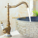 Antique brass single handle faucet with ceramic base bathroom sink