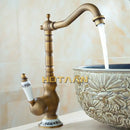 Antique brass single handle faucet with ceramic base bathroom sink