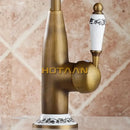 Antique brass kitchen faucet with floral ceramic handle