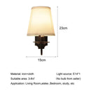 Antique bronze iron wall lamp with cream fabric shade for bedroom