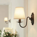 Antique bronze iron wall lamp with cream fabric shade for bedroom