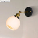 Industrial brass wall sconce with bubble white glass for bedroom