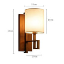Chinese style cloth wall lamp for bedroom with geometric metal frame