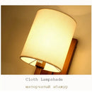 Chinese style cloth wall lamp for bedroom with geometric metal frame