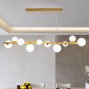 Modern gold and wood pendant with frosted globe shade dining room