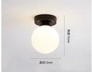 Modern brass & black glass ball ceiling light for living room
