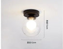 Modern brass & black glass ball ceiling light for living room