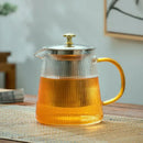 Modern glass teapot with gold knob and cups dining room tea set