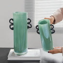 Modern mint green glass vase with black handles living room decor