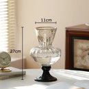 Textured clear glass vase with black base living room decor