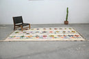 Traditional beige azilal rug with geometric patterns for living room