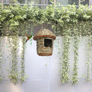 Handwoven straw bird nest with hanging rope for garden decor